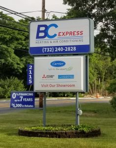 BC Express Heating and Air Conditioning Signage with logo and phone number, showroom and brands including Carrier, Mitsubishi Electric and Energy Star.