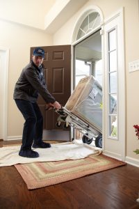 Technician providing a new water heater installation