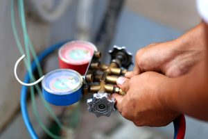 technician performing boiler maintenance