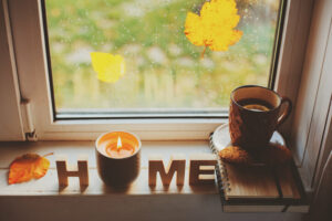 fall window leaves home candles